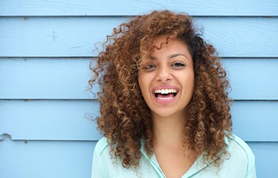 woman smiling after cosmetic dentistry procedure in Marysville, WA